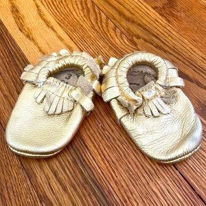 Gently used gold Freshly Picked Moccasins size 3